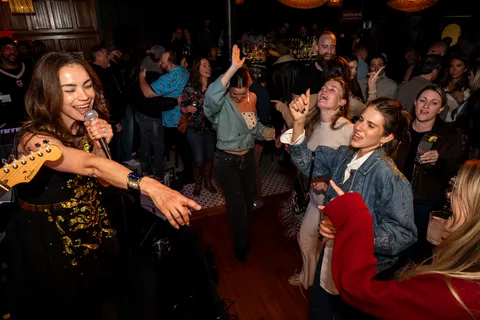 Musician on stage interacting with crowd