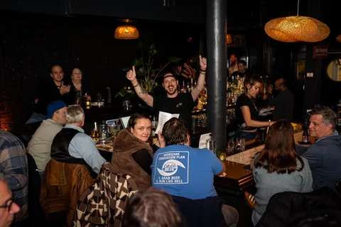 A crowd of people enjoying a lively bar