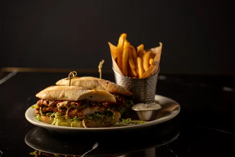 Poboy sandwich with fries on a table