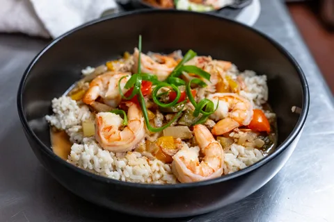A delicious shrimp and rice dinner in a cast iron serving dish