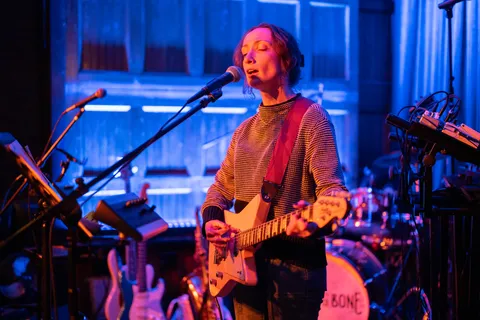 Musician on stage with guitar